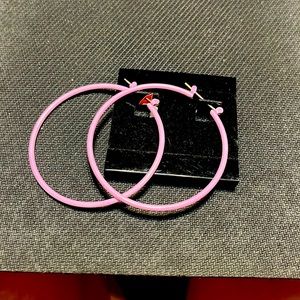 Vintage pair of pink earrings. Round hoops 1 inch long.